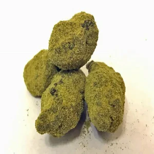 Sour Apple MoonRock cannabis flower, coated in hash oil and kief, offering tangy apple flavors and potent effects for an enhanced smoking experience.