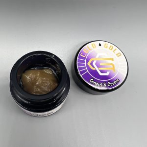 Cold Gold Live Rosin cannabis extract, showcasing a smooth texture with 2g of premium, solventless cannabis concentrate.