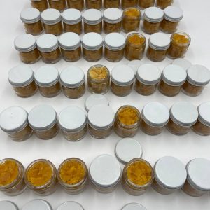 Ferrari Runts Live Resin cannabis extract featuring a golden, sticky texture for potent and flavorful dabbing or vaping.