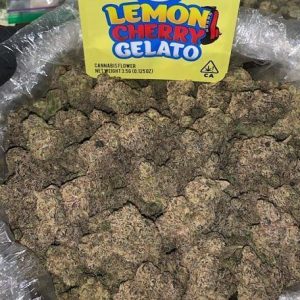 Lemon Cherry Gelato cannabis flower showcasing dense, colorful buds with frosty trichomes.